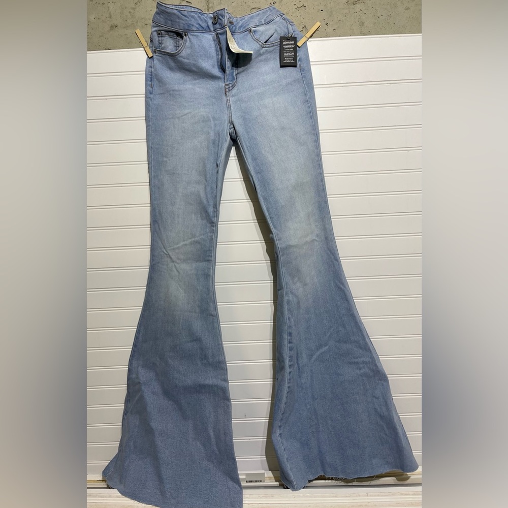 Brand new flare jeans with cute back lace detail! Stretchy denim!